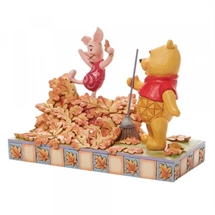 Disney Traditions - Piglet playing in a pile of leaves H: 14 cm.