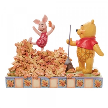 Disney Traditions - Piglet playing in a pile of leaves H: 14 cm.