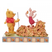 Disney Traditions - Piglet playing in a pile of leaves H: 14 cm.